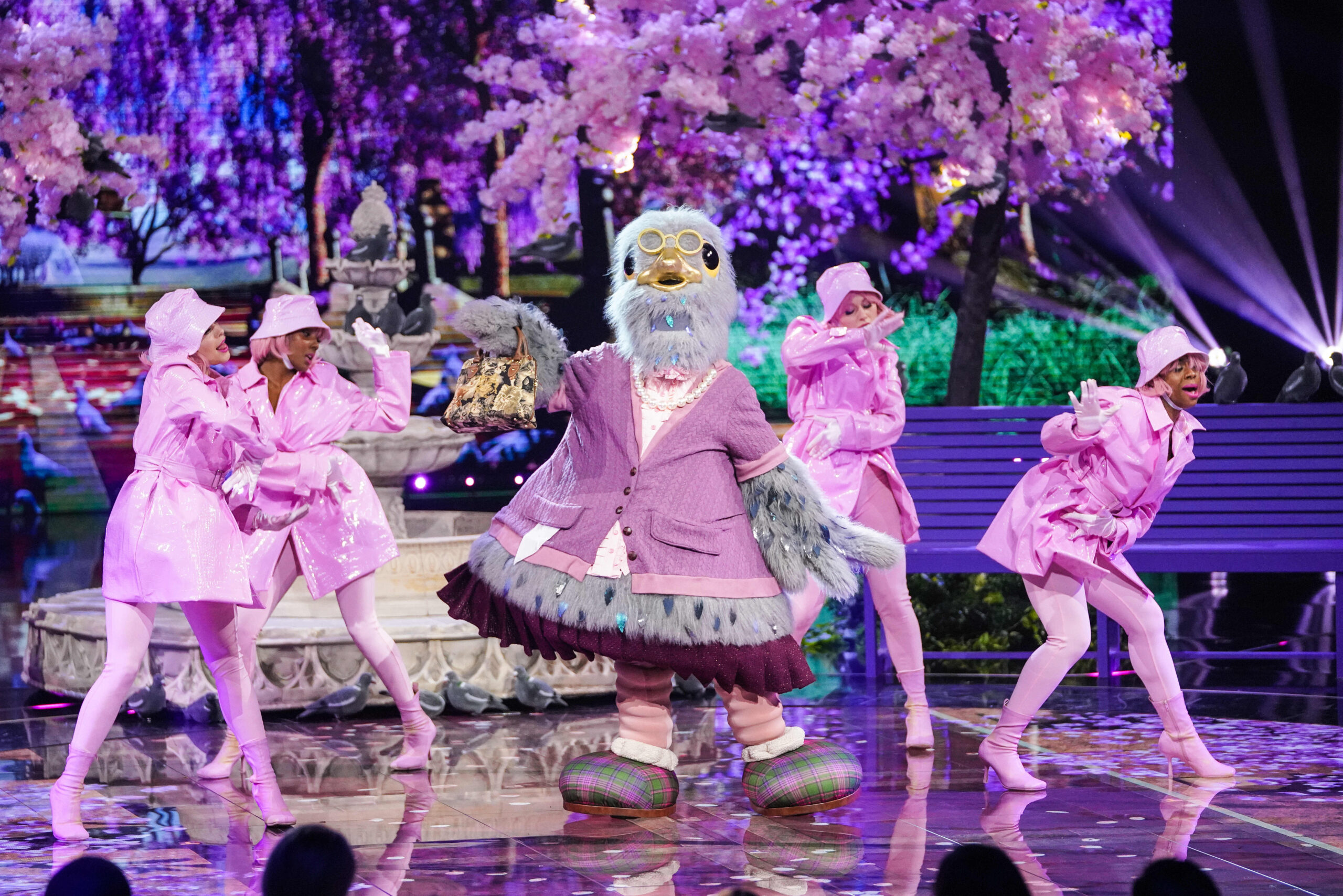 Pigeon dances alongside dancers in The Masked Singer
