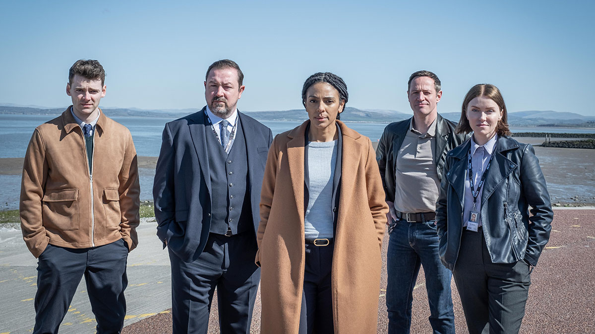 The cast of The Bay frown on a beach in Morecambe