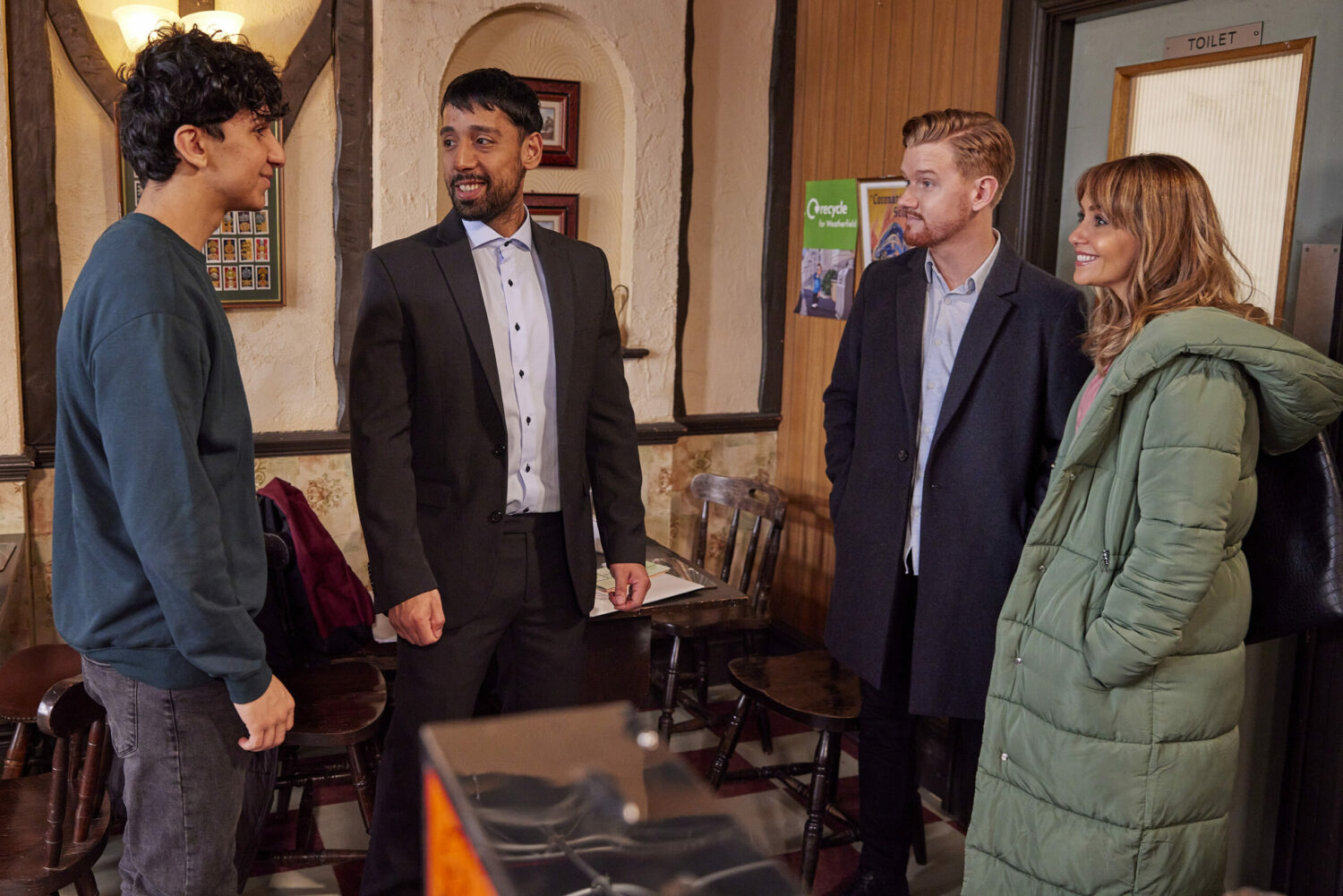 Daryan and the other refugee smile as they talk to delighted Maria and Gary