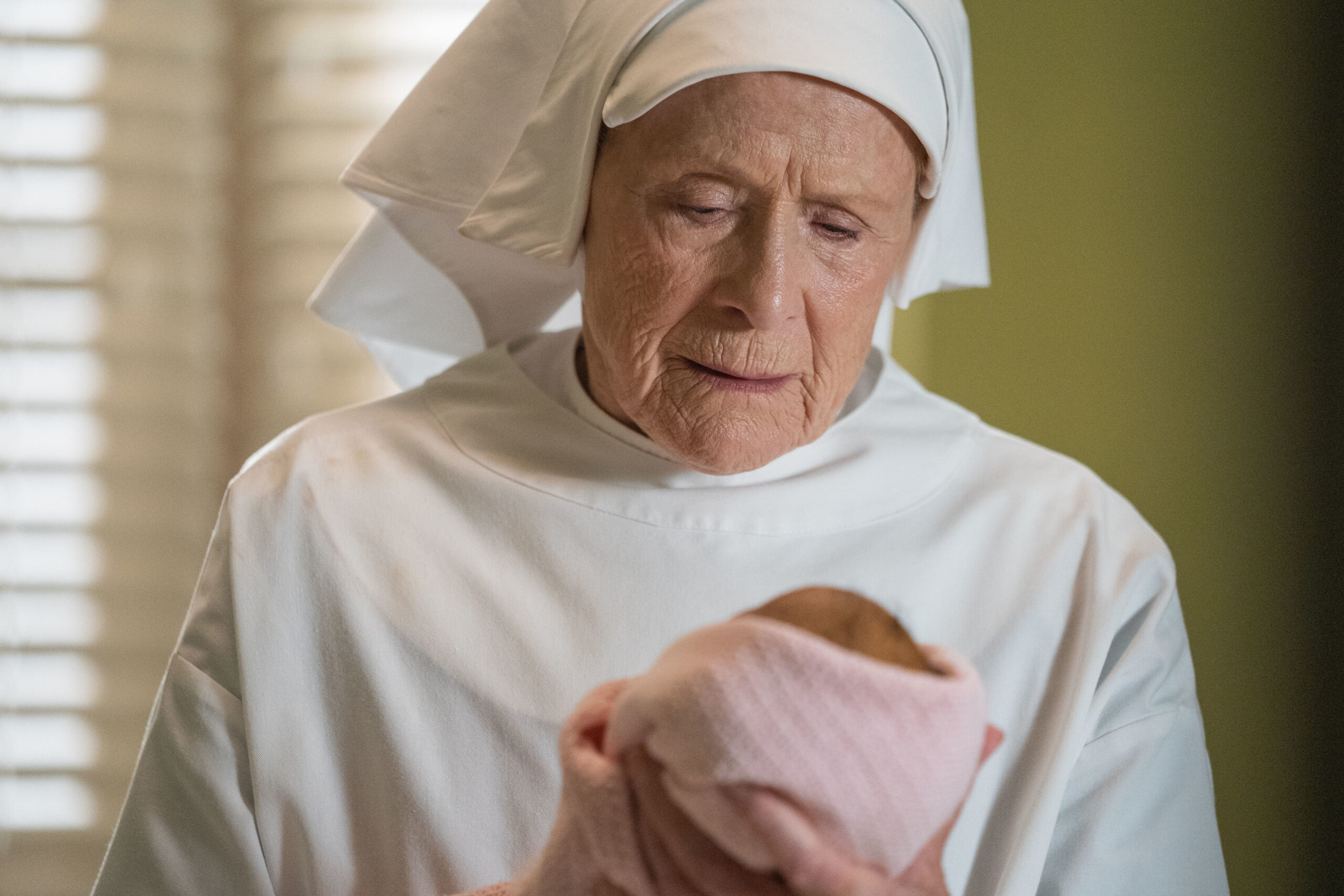 Sister Joan holds a baby in Call the Midwife
