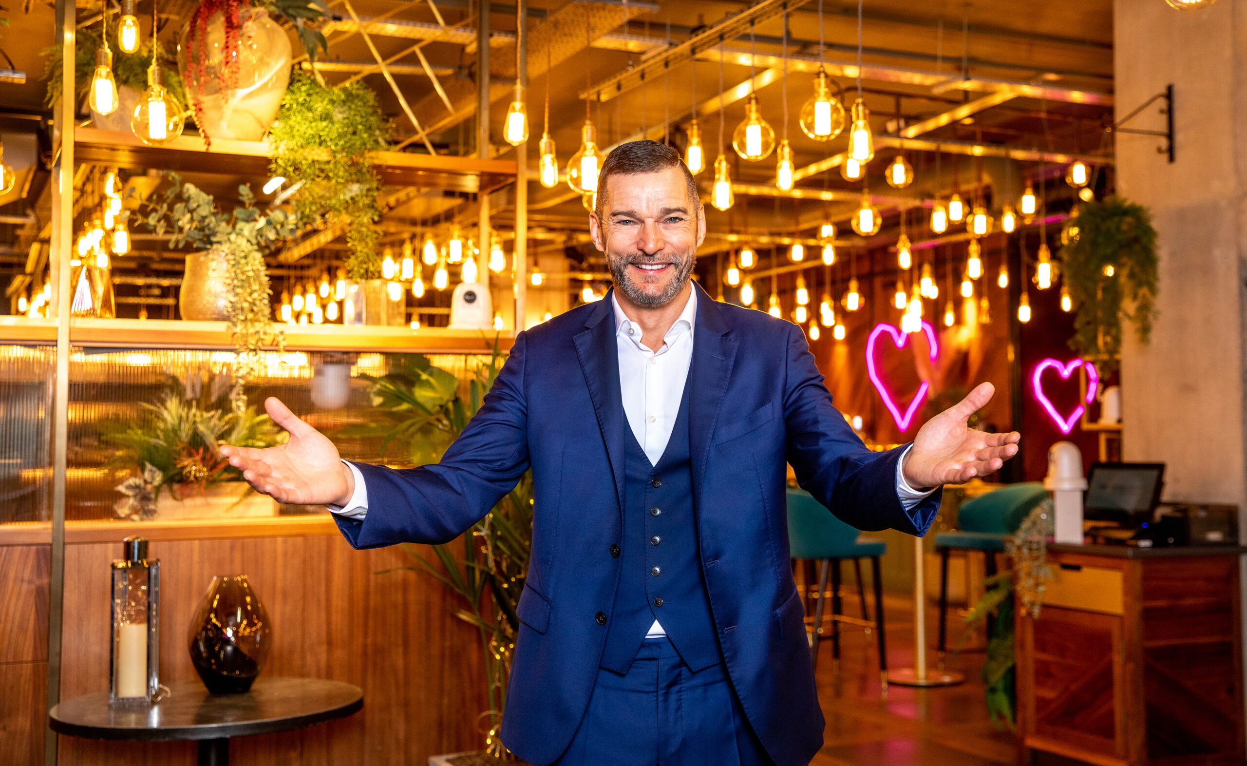 Fred smiles in First Dates restaurant