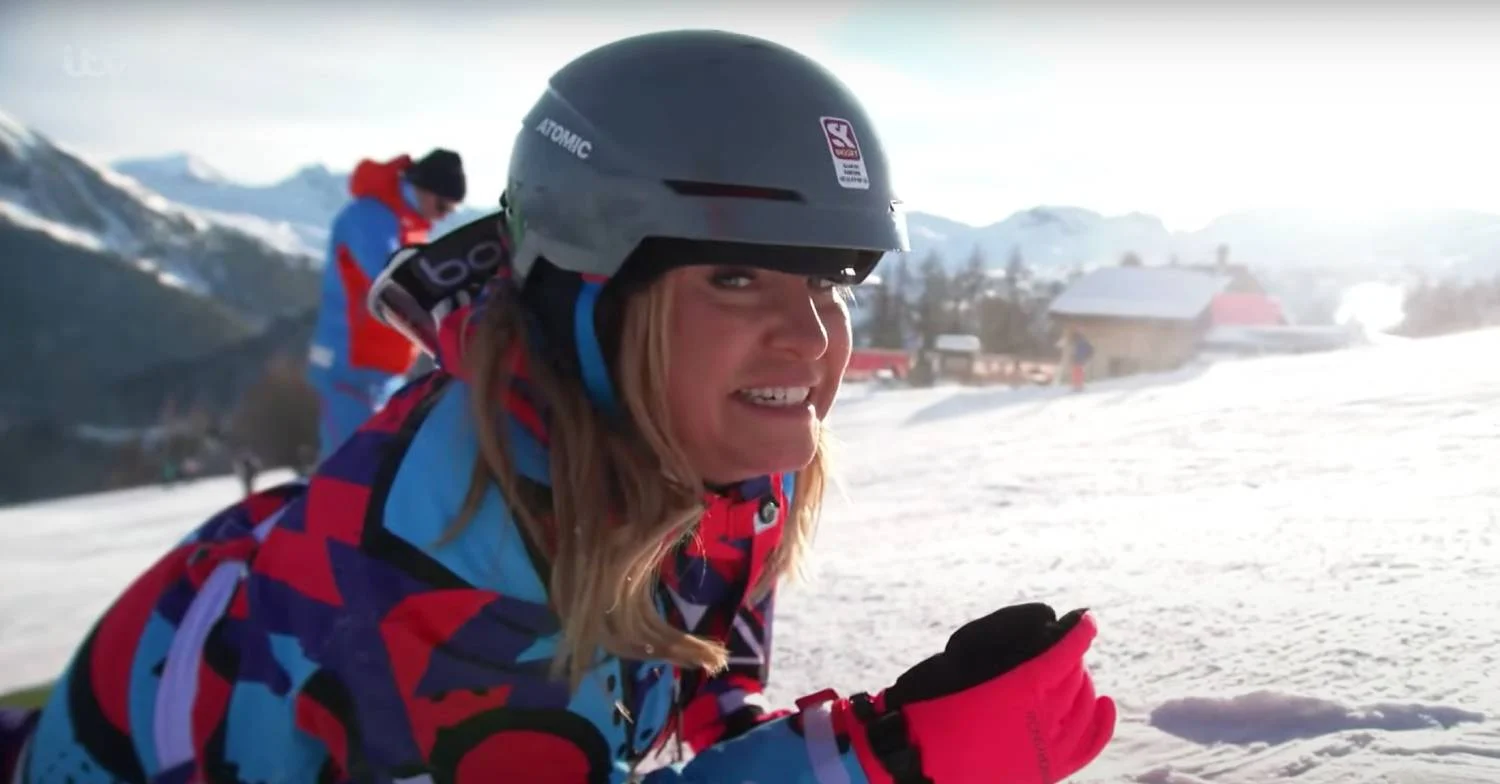 Josie Gibson lying in some snow 