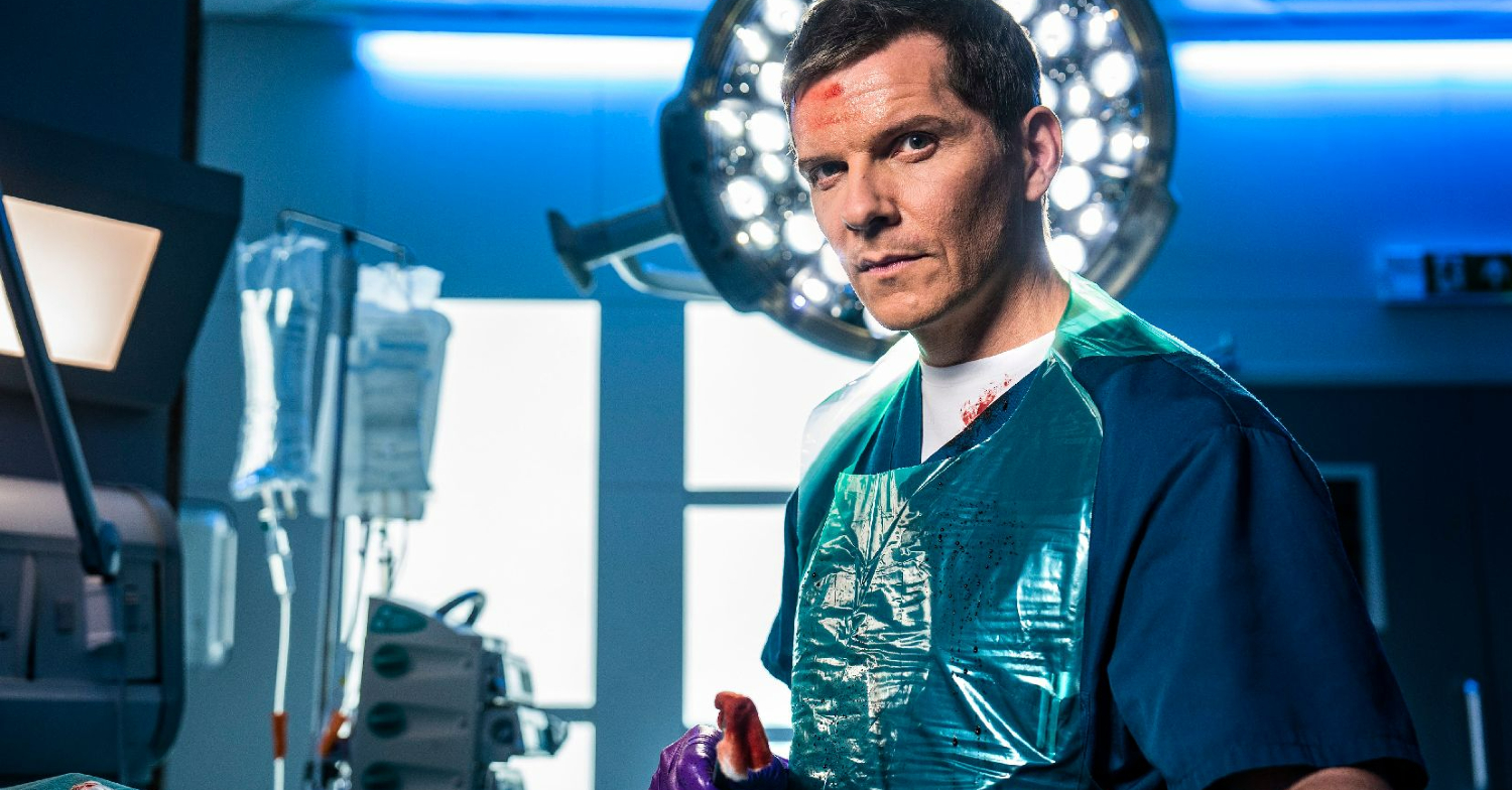 Max Cristie is wearing scrubs whilst operating in Casualty
