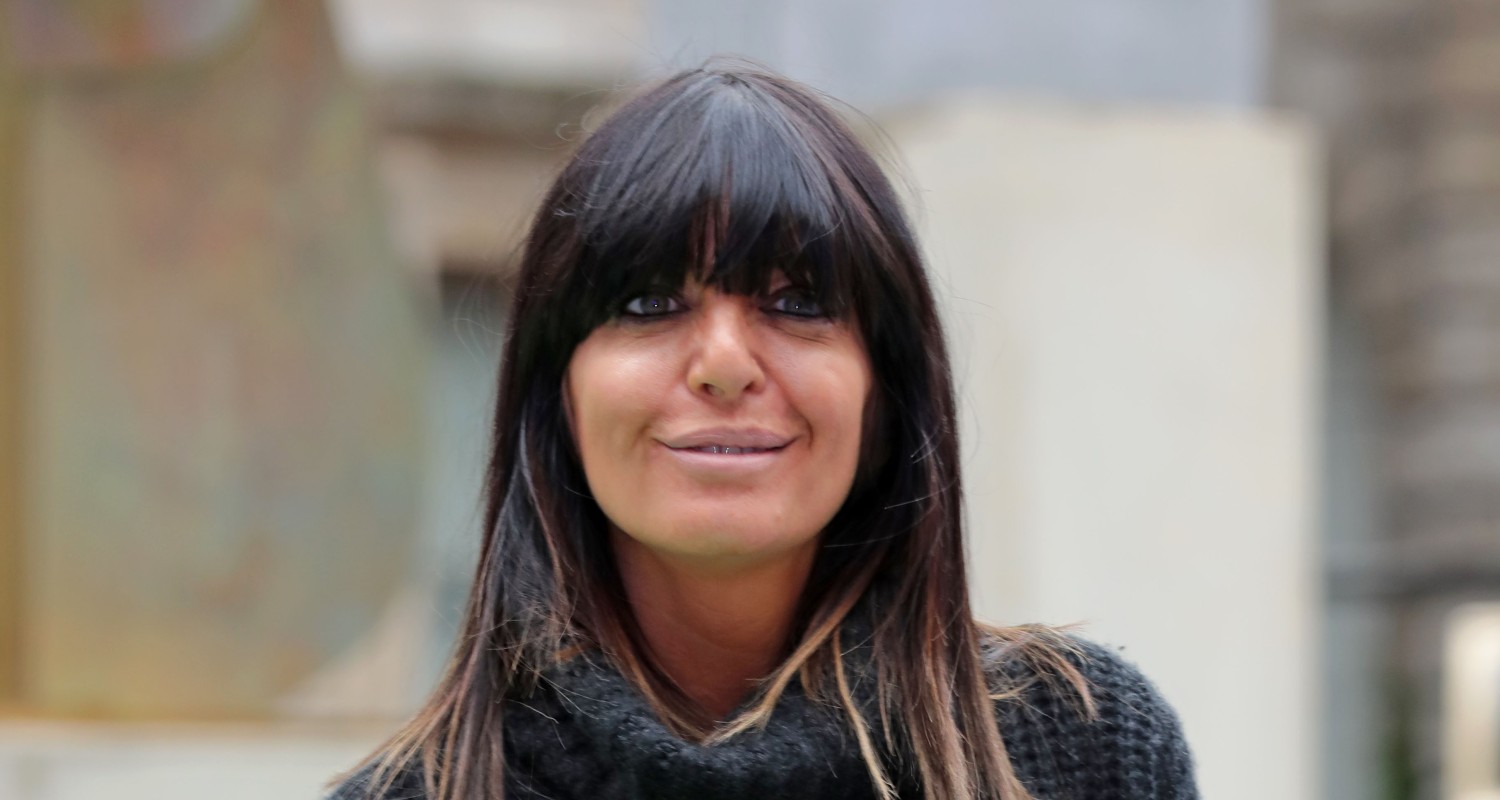 Claudia Winkleman smiles at camera with full fringe