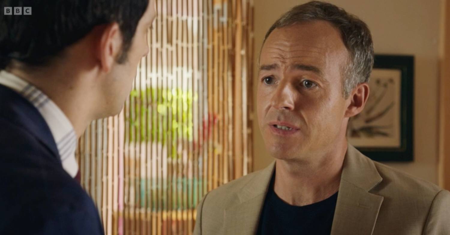 Death In Paradise detective Neville Parker speaks with David Cartwright