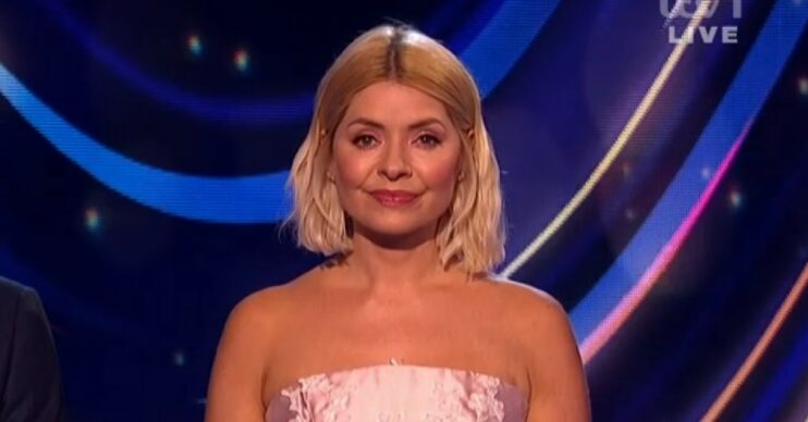 Holly Willoughby smiles as she hosts Dancing on Ice