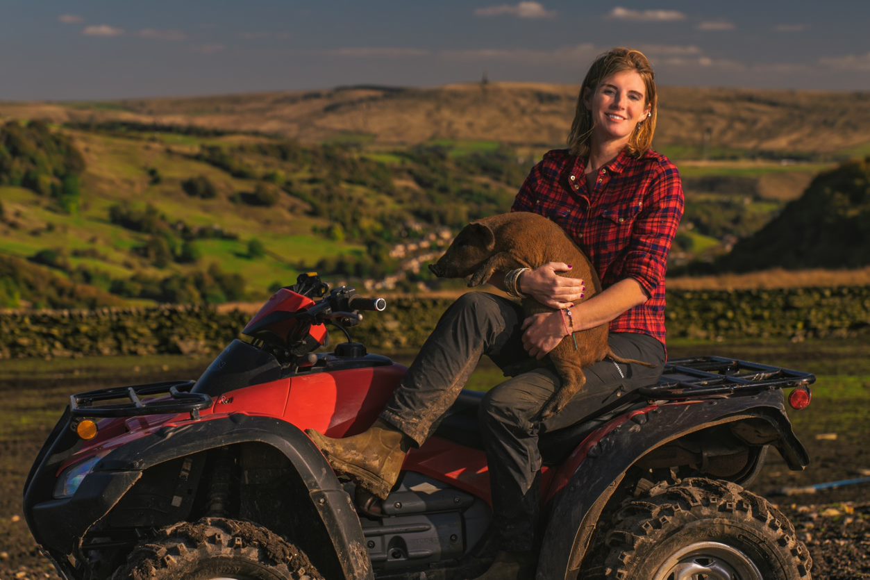 Amanda Owen sitting on a tractor in Farming Lives