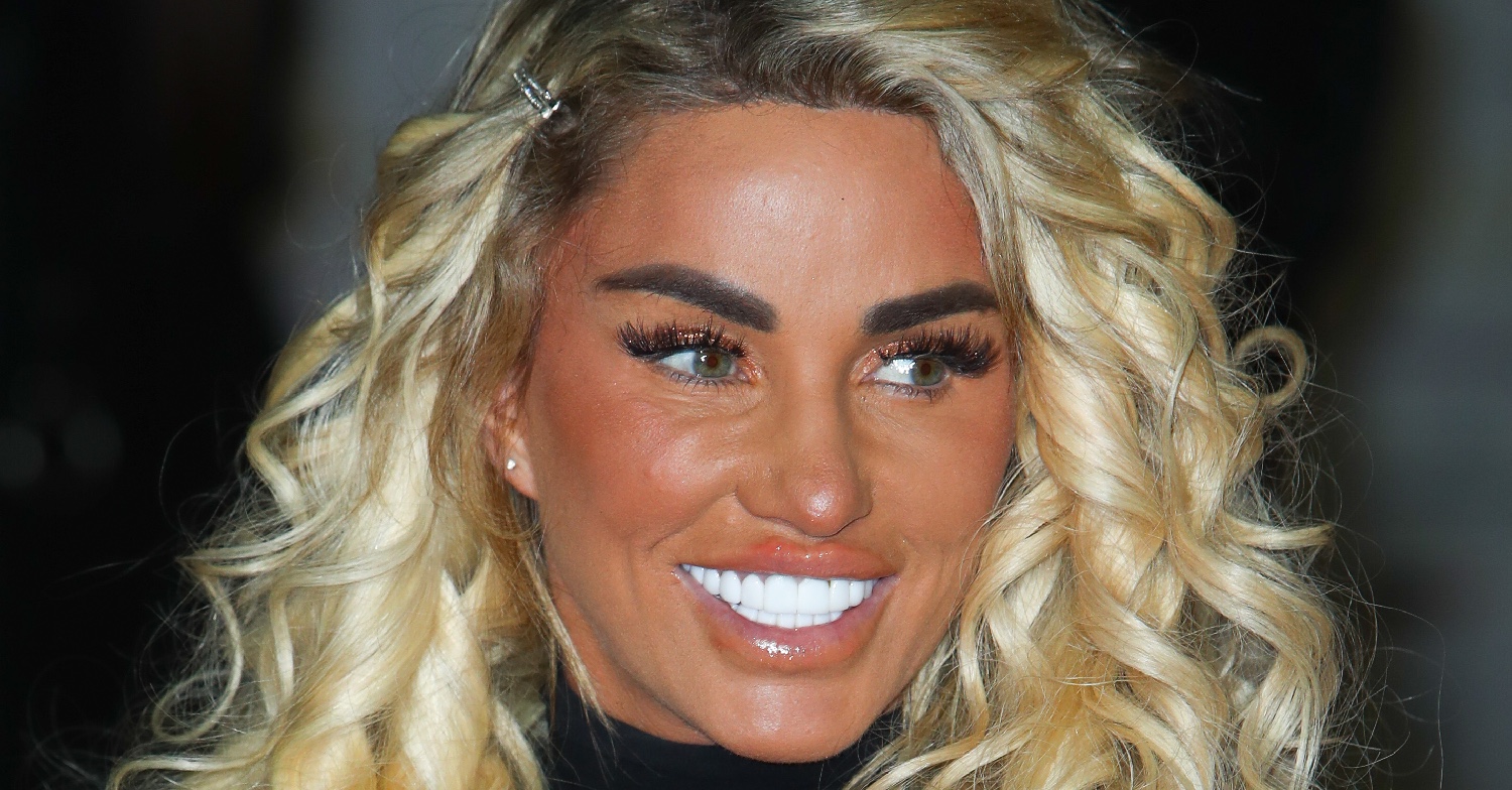 Katie Price smiling with blonde curly hair