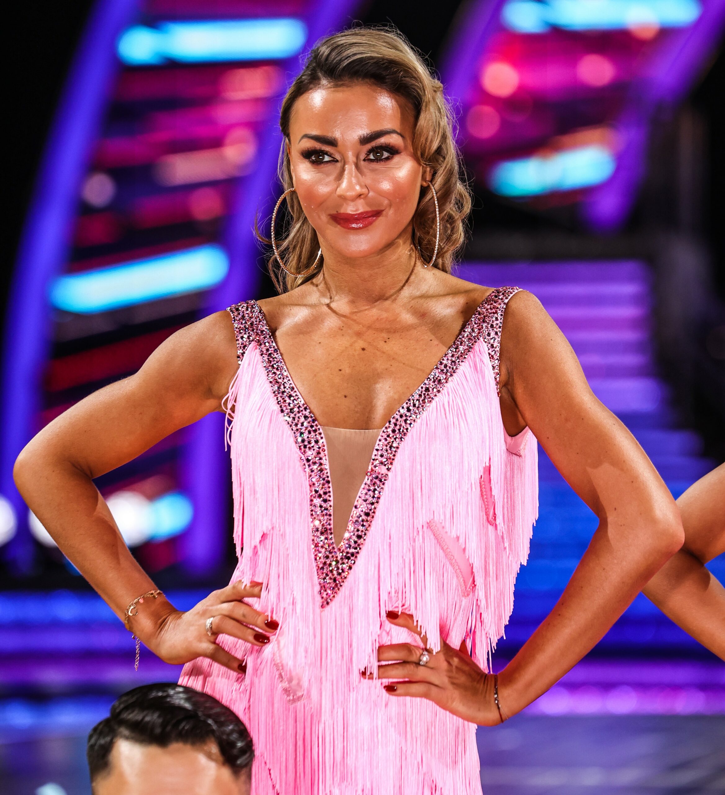 Luba Mushtuk posing in pink dress on Strictly tour