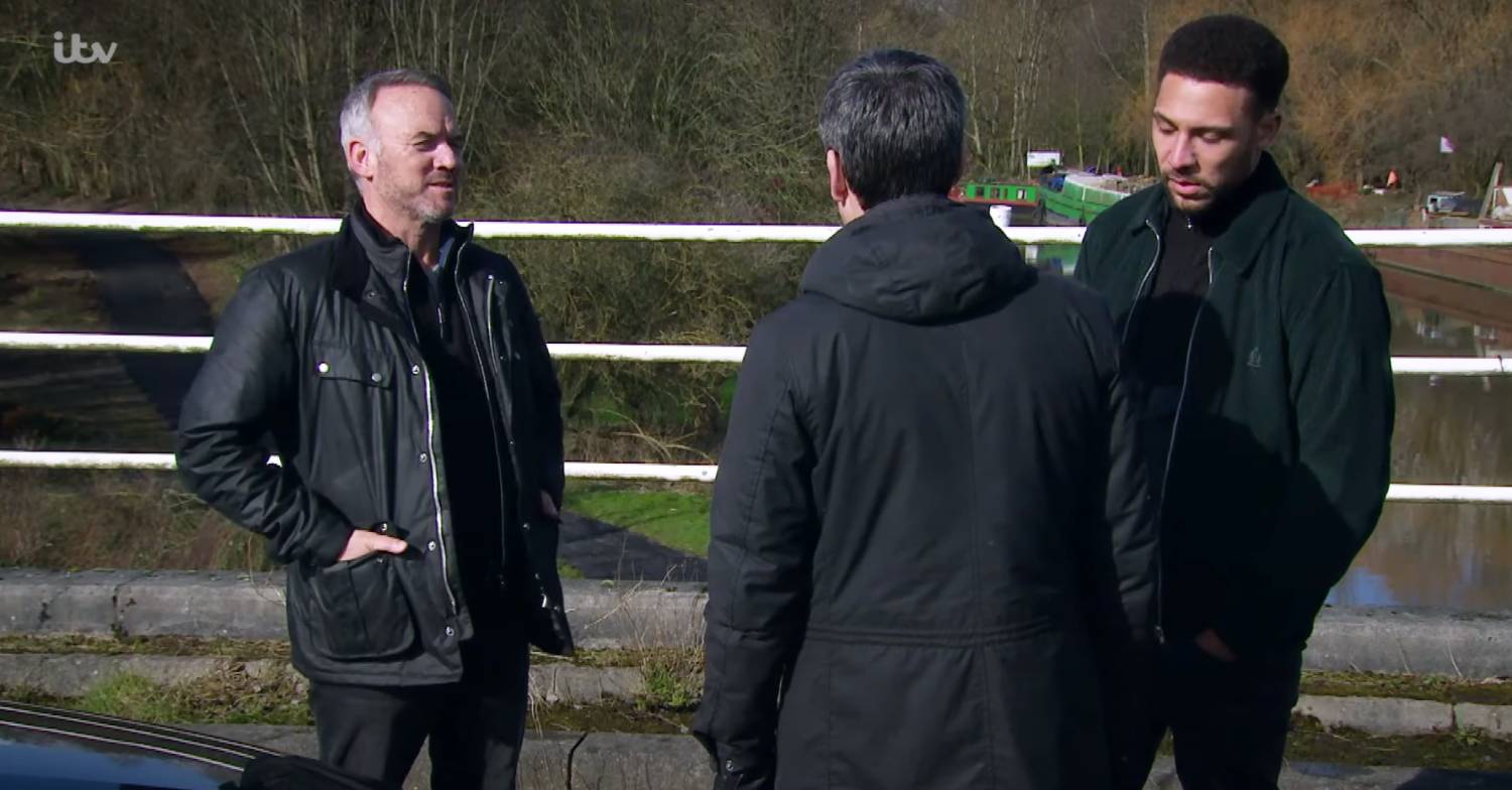 Mark Womack in Emmerdale playing Malone in a scene with Cain and Billy