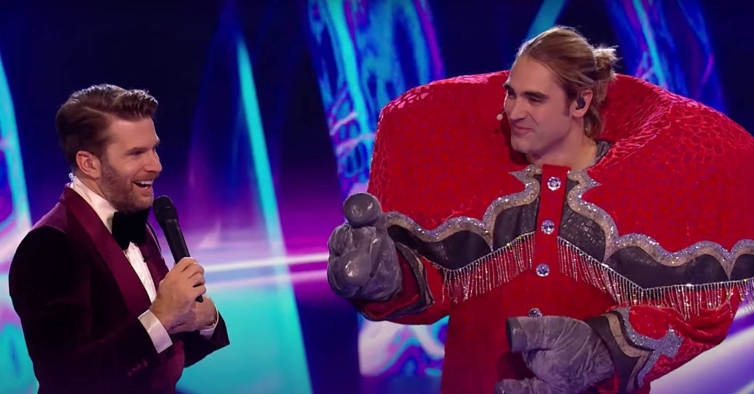 Masked Singer 2023 winner Charlie Simpson is interviewed by Joel Dommett