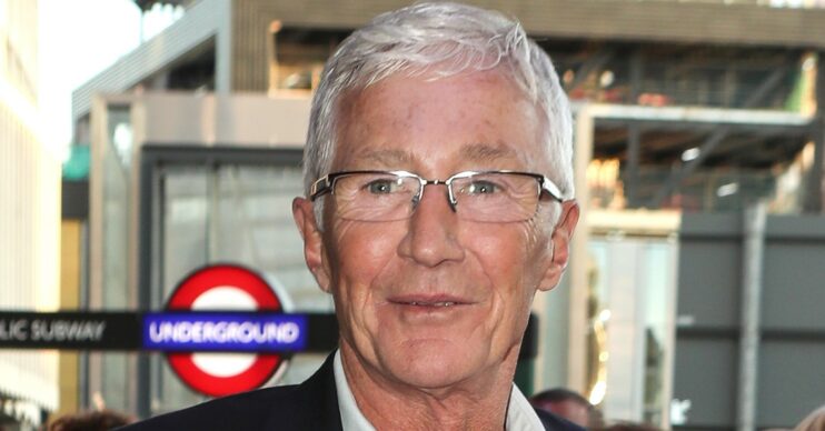 Paul O'Grady smiling at the camera at event