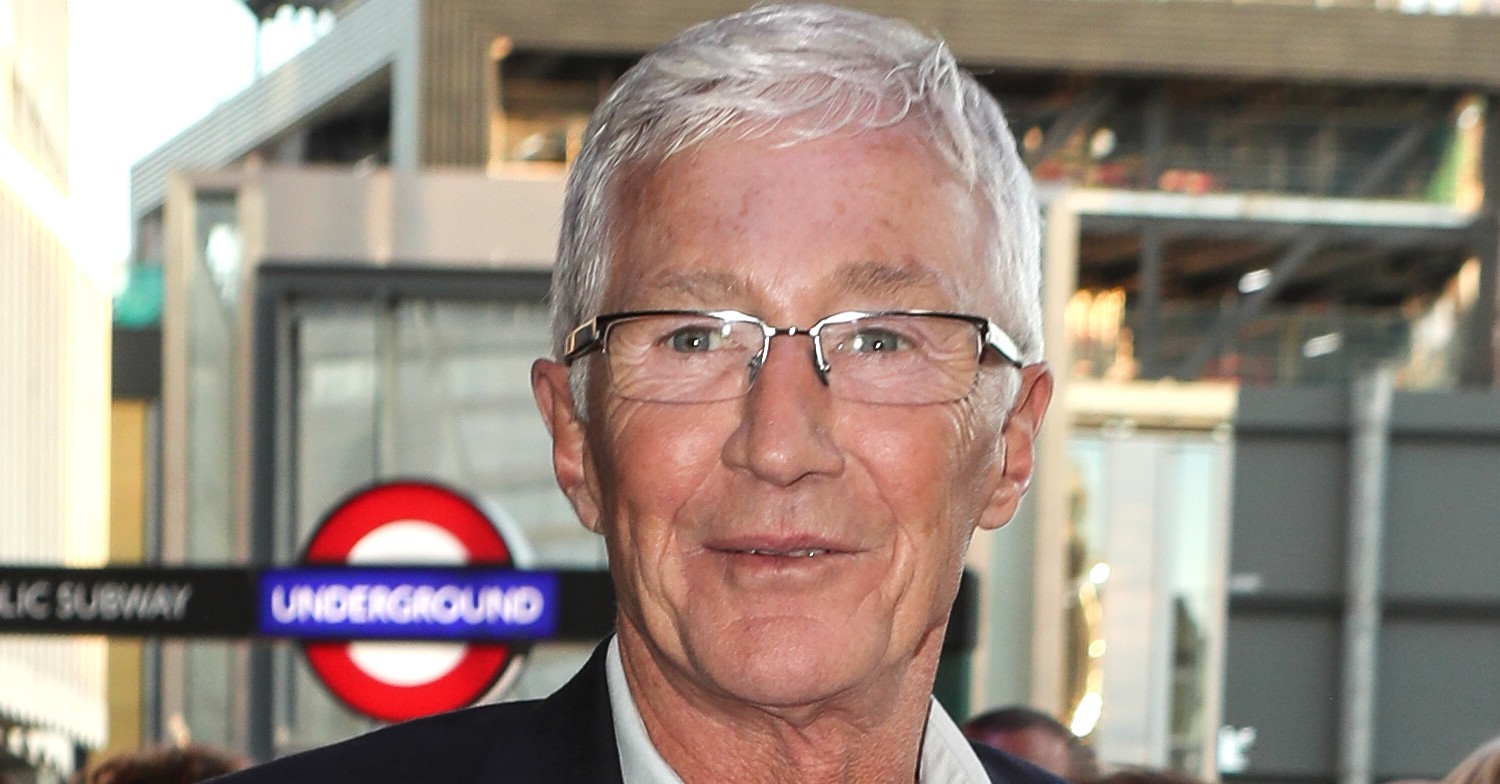Paul O'Grady smiling at the camera at event