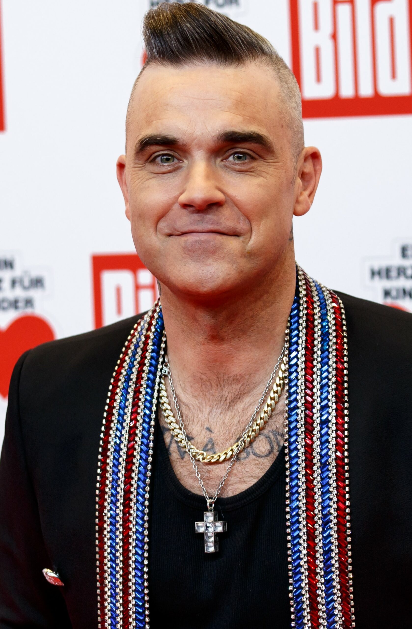 Robbie Williams smiling at event