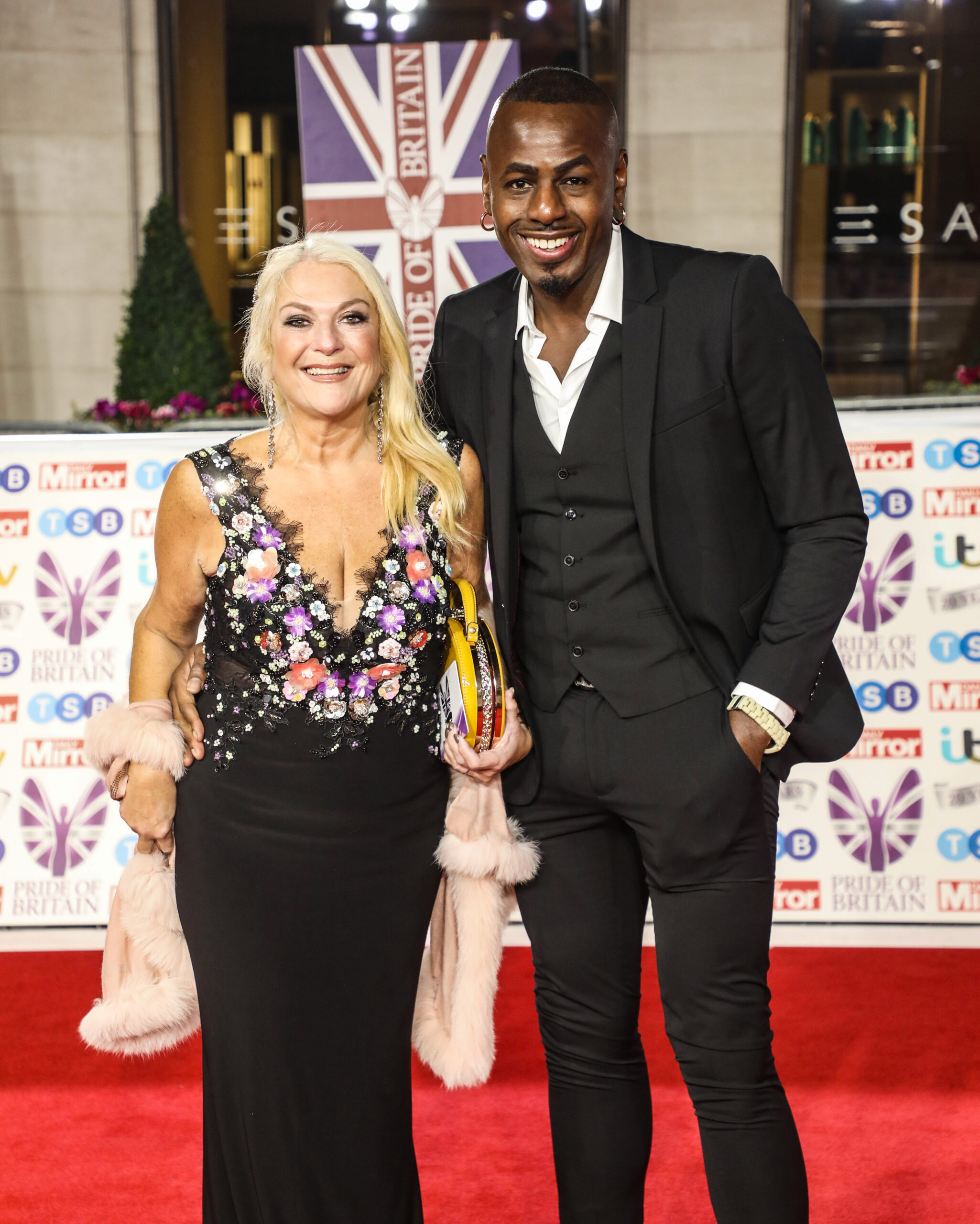 Vanessa Feltz and Ben Ofoedu smiling on the red carpet
