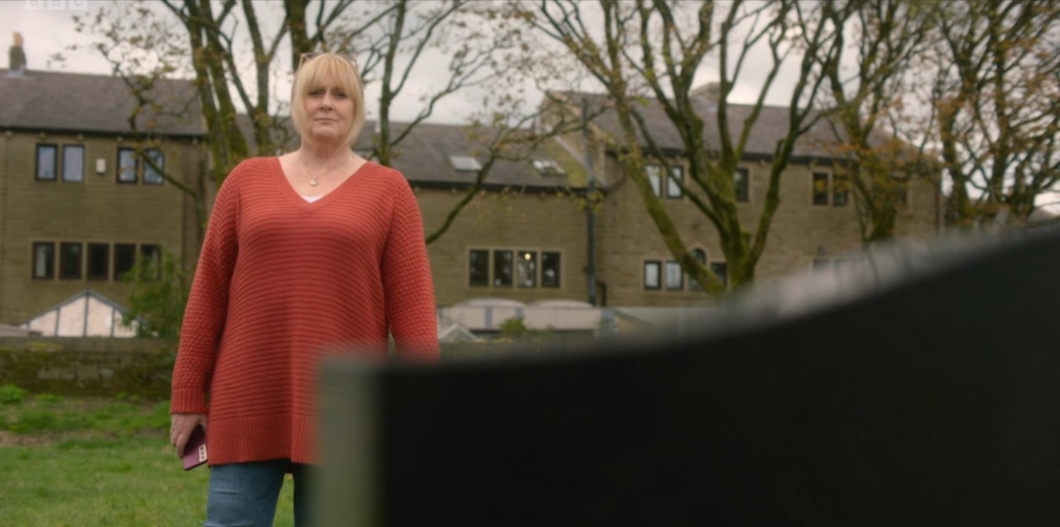 Sarah Lancashire looking at headstone on Happy Valley
