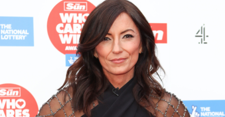 Davina McCall smiling on the red carpet