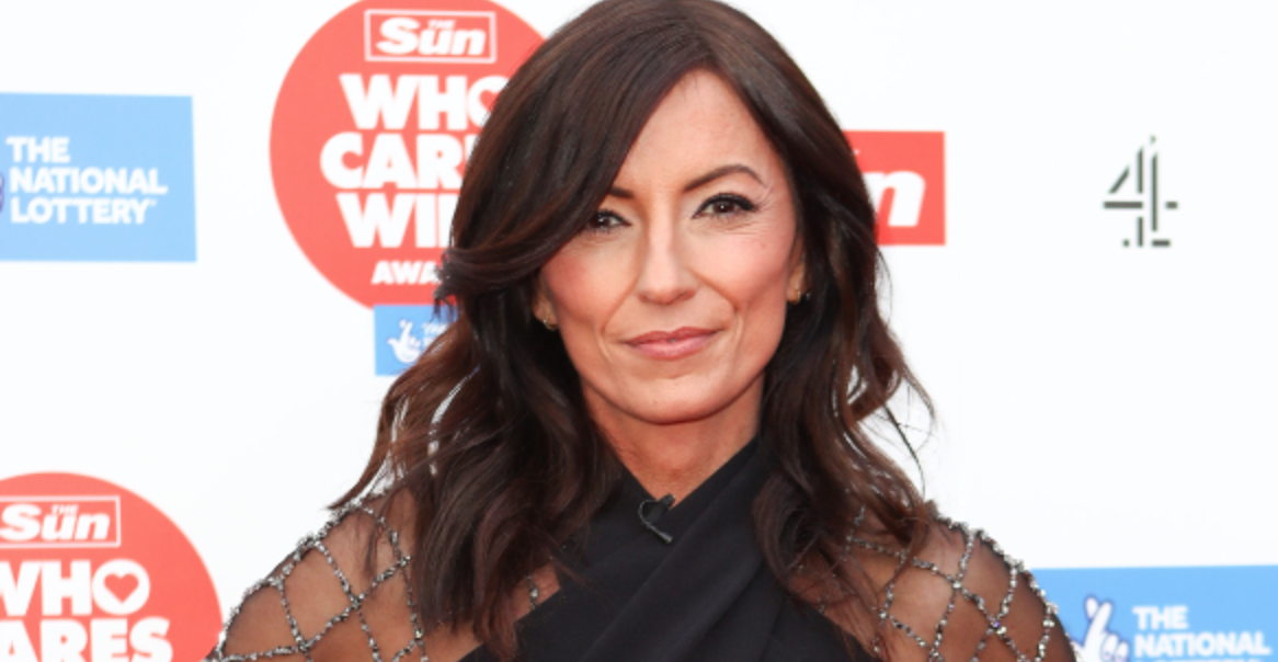 Davina McCall smiling on the red carpet