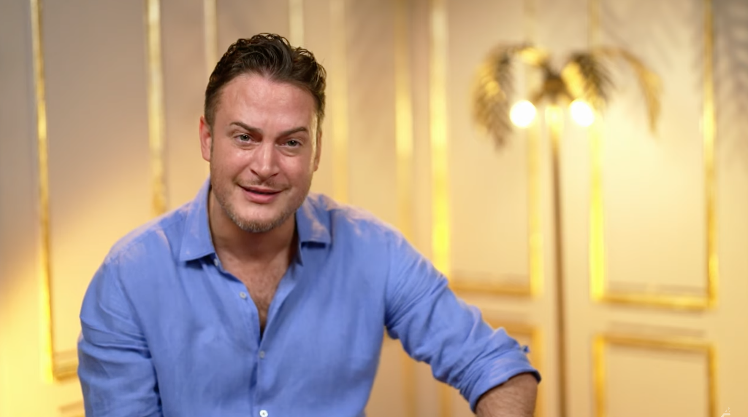 Gary Lucy looking annoyed in a blue shirt
