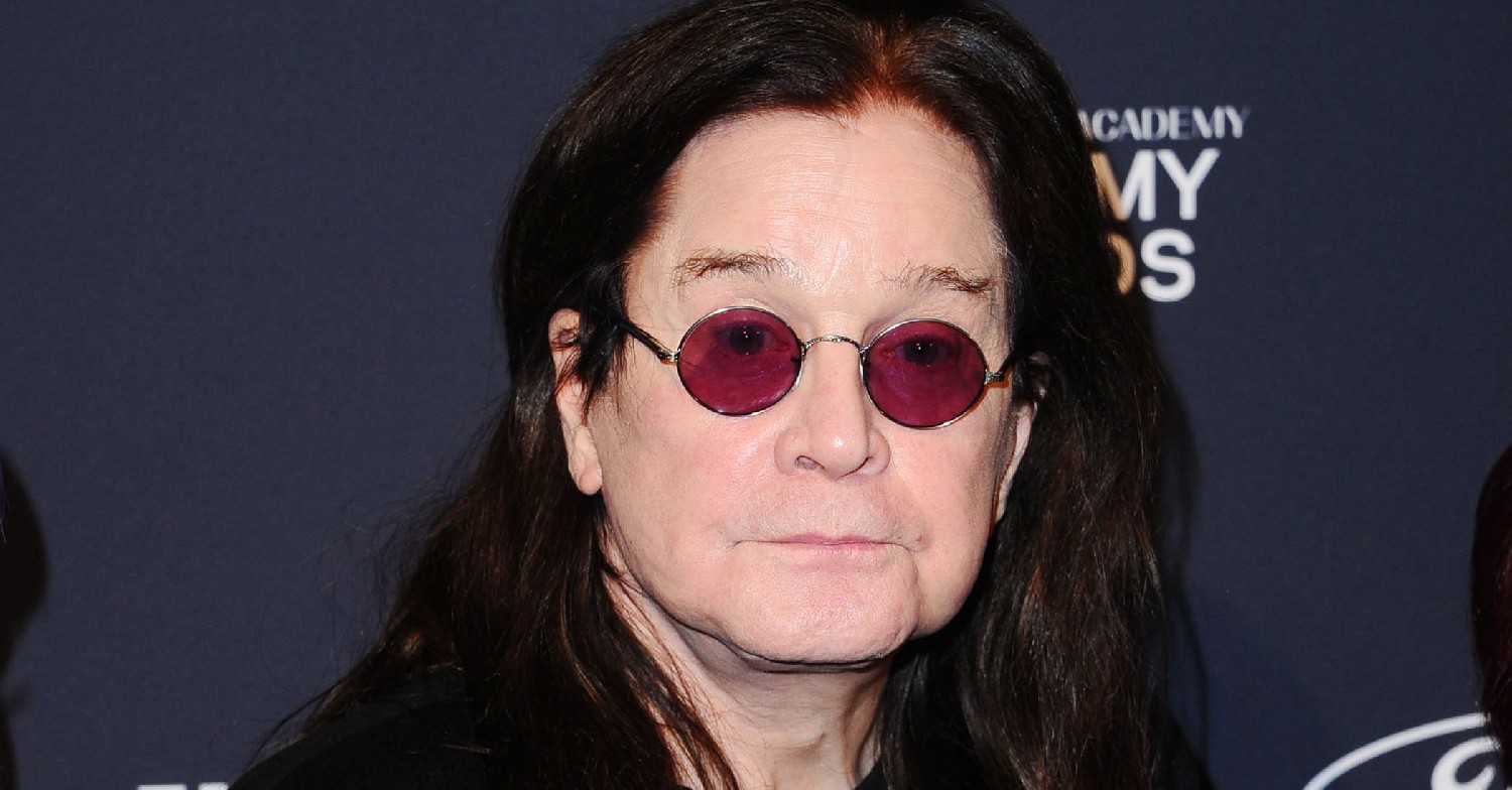 Ozzy Osbourne wearing glasses at a red carpet event 