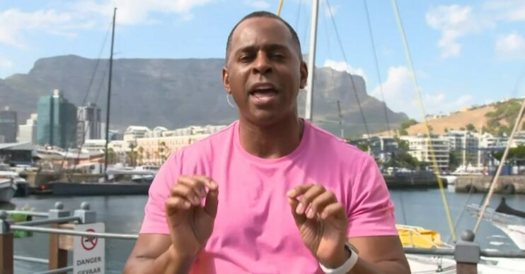 Andi Peters in a pink tshirt speaking from South Africa on GMB today