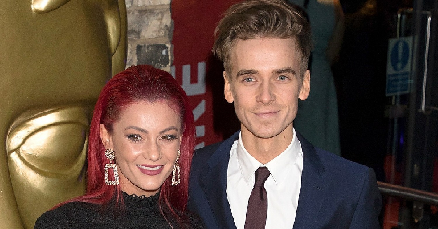 Dianne Buswell and Joe Sugg posing at an event 