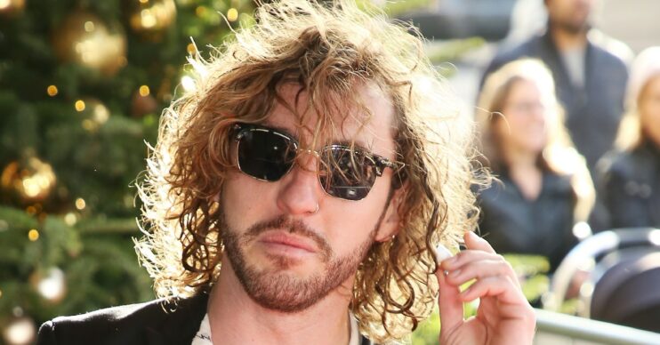Seann Walsh posing for the camera at an event