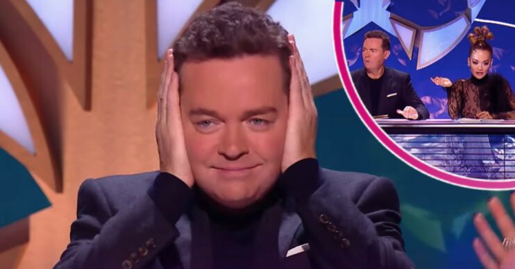 Stephen Mulhern covering his ears and on the panel on The Masked Singer