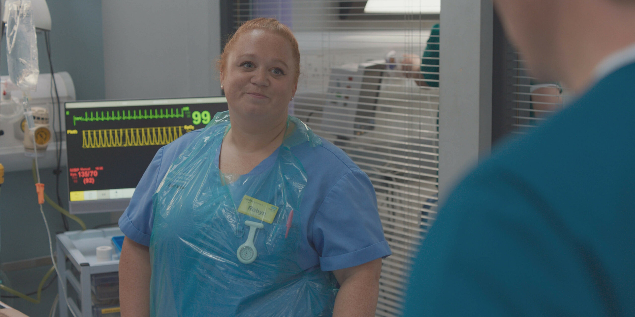 Robyn is smiling at work