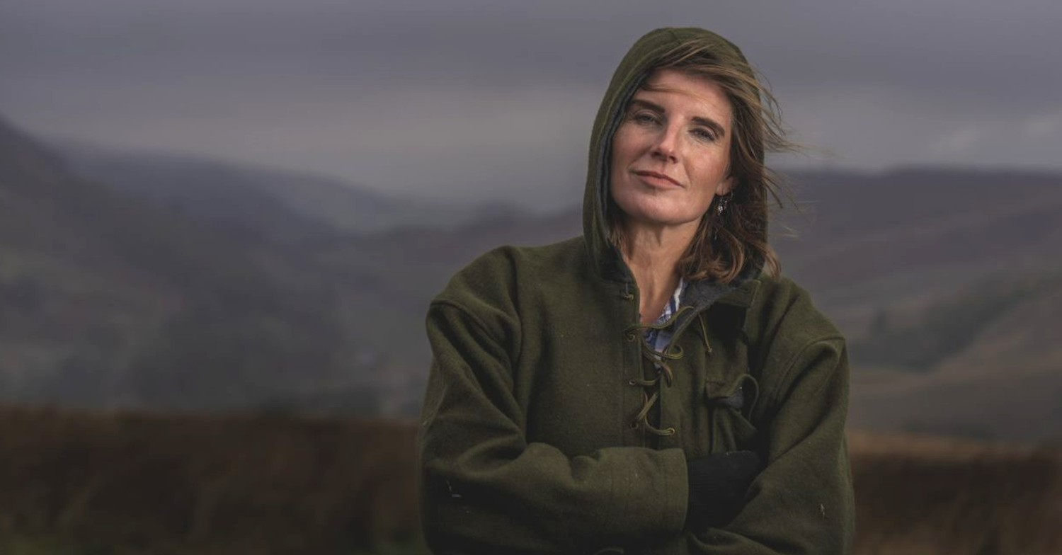 Farming Lives host Amanda Owen posing on a farm