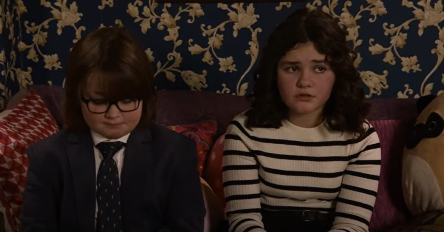 Coronation Street's Sam and Hope are sitting awkwardly on the sofa