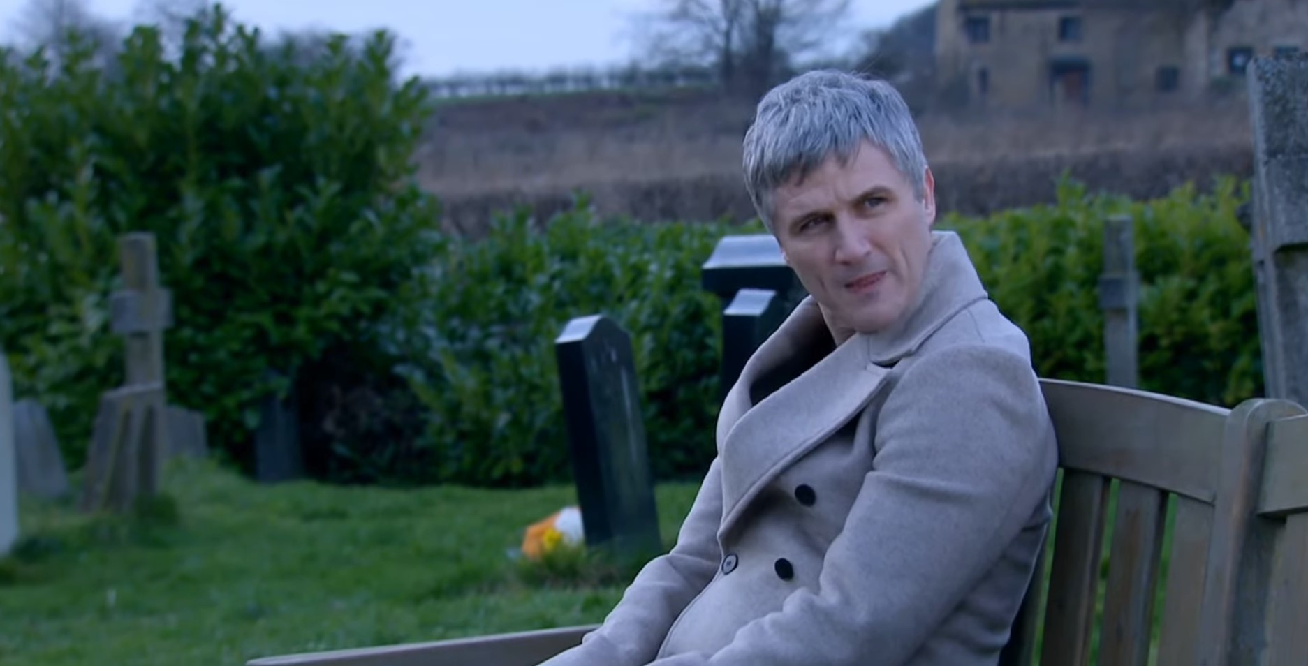 Caleb looks thoughtful as he talks to Leyla in the graveyard in Emmerdale