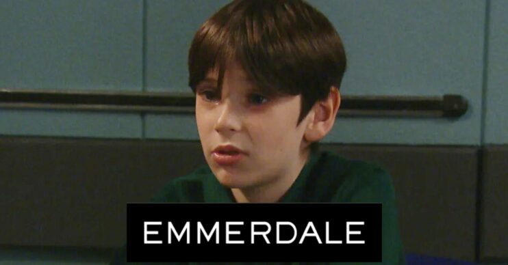 Emmerdale's Kyle looking worried in the police station with the Emmerdale logo comp image