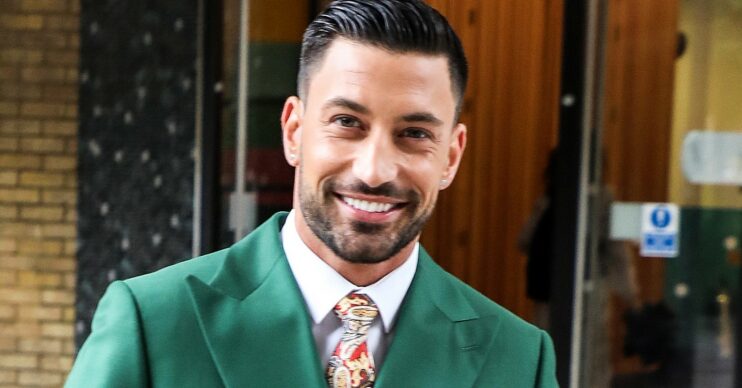 Giovanni Pernice wearing green and smiling