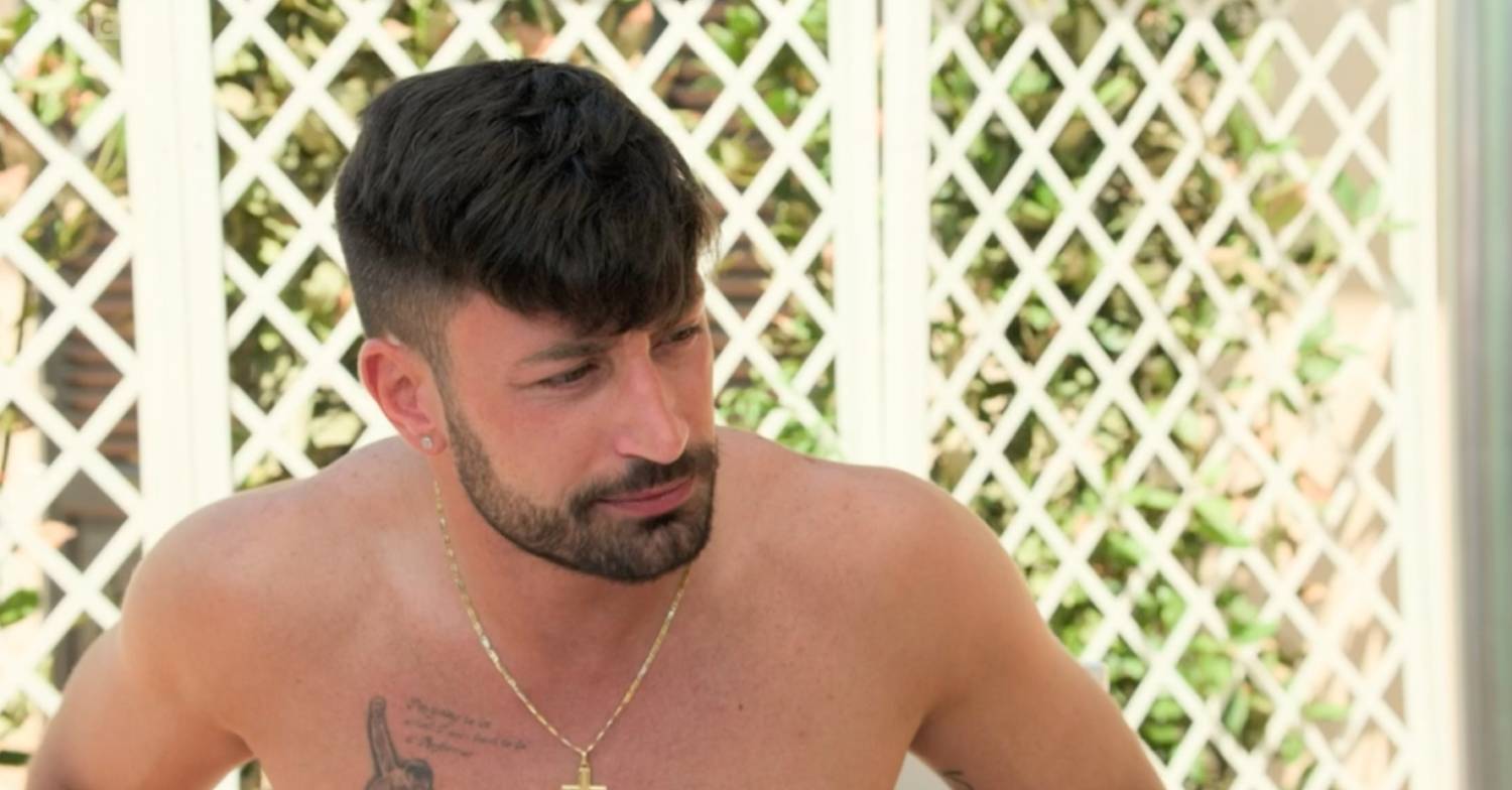 Giovanni Pernice frowns while topless