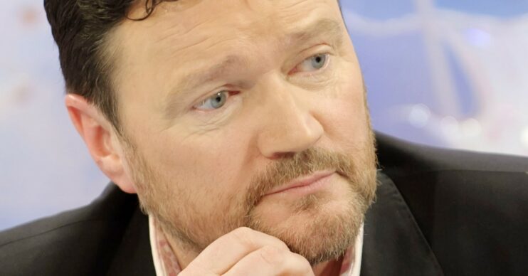 Ian Puleston-Davies looking thoughtful with hand on chin