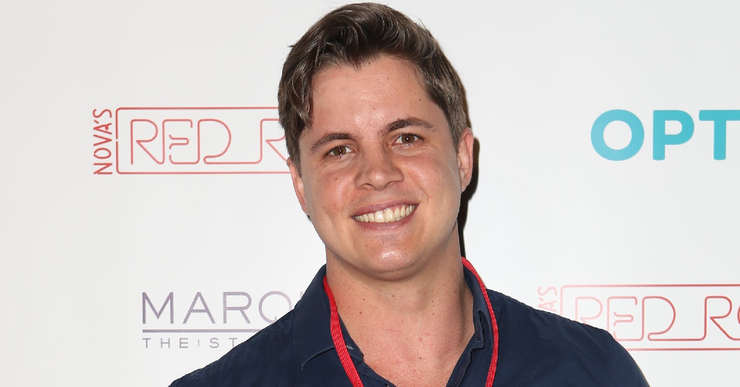 Johnny Ruffo smiling on the red carpet