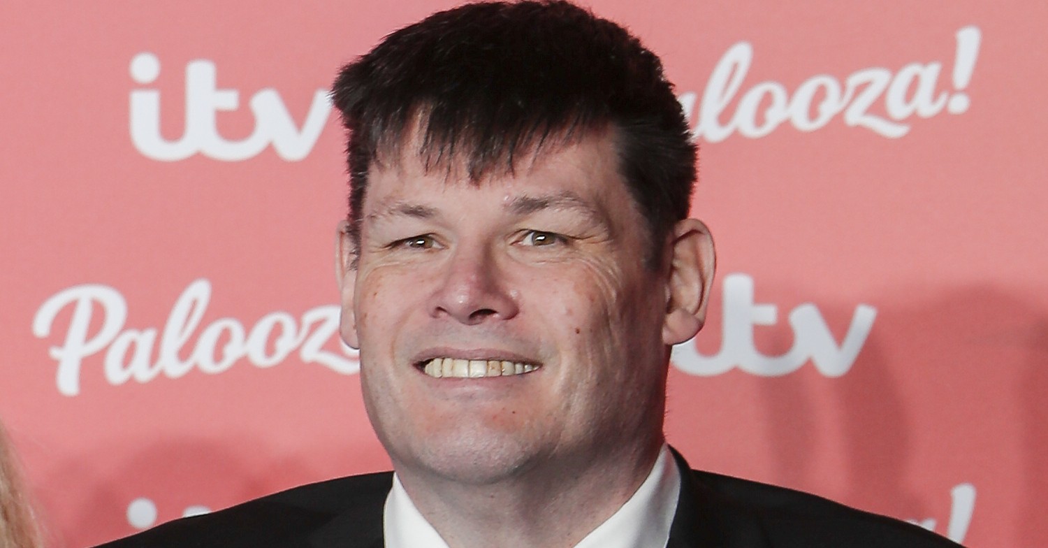 Mark Labbett smiling in suit at ITV Palooza