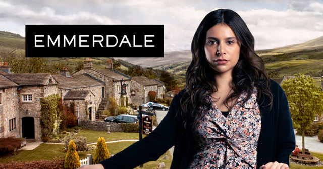 Emmerdale's Meena looking smug on a village background comp image