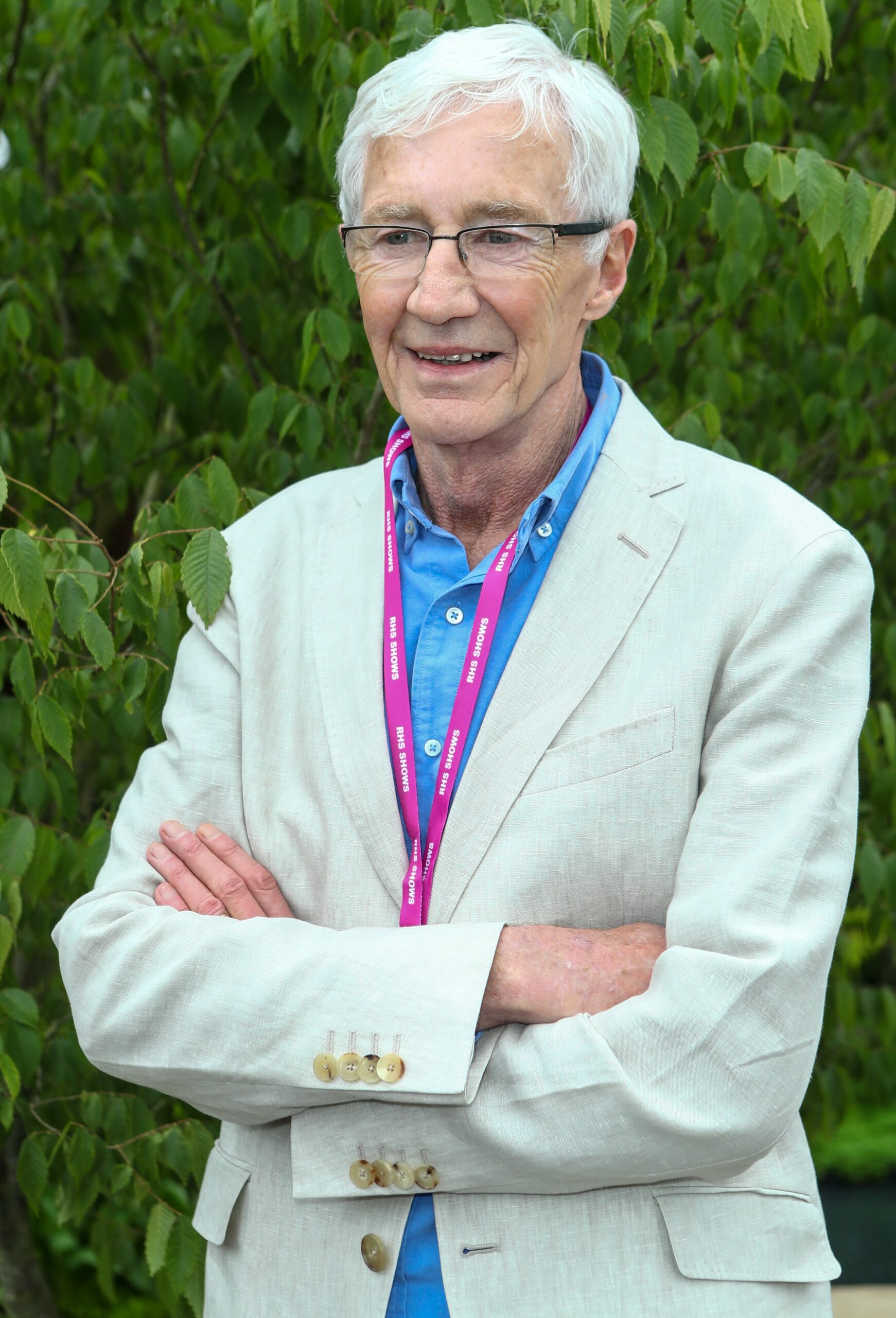 Paul O'Grady with his arms crossed at Chelsea Flower Show