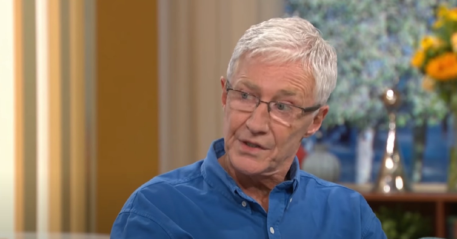 Paul O'Grady in blue shirt, talking on This Morning