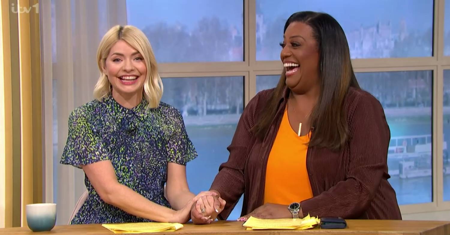 Holly Willoughby and Alison Hammond clasp hands