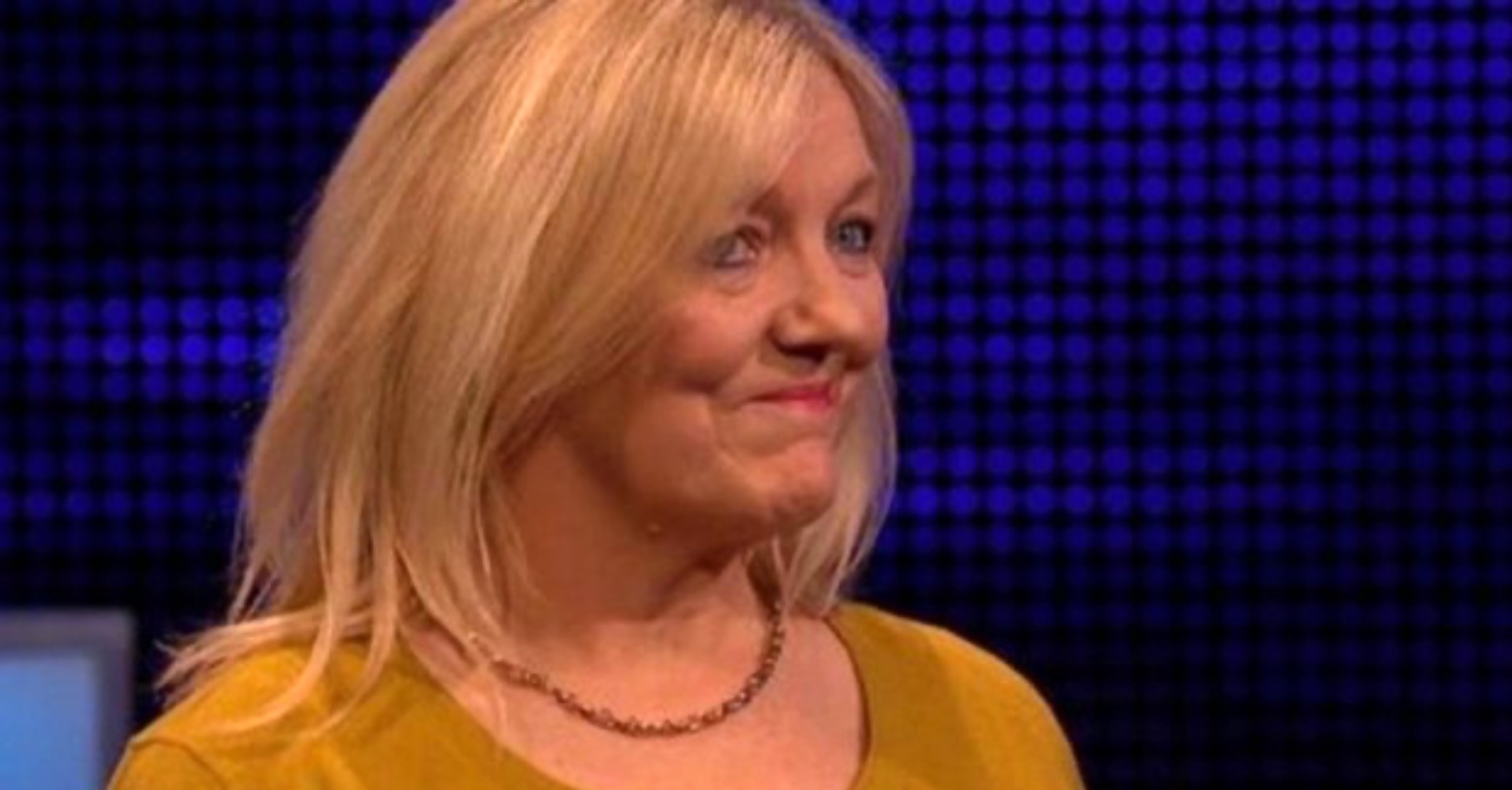 Debbie wearing a yellow cardigan on The Chase