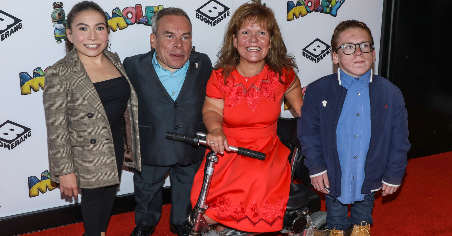 Annabelle, Warwick Davis, Samantha and Harrison smiling at event