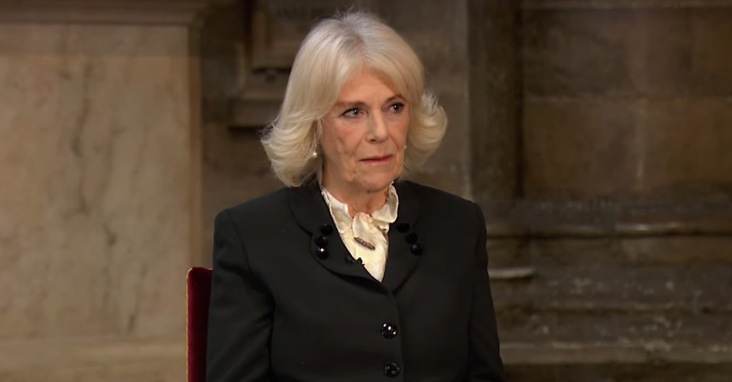 Queen Consort Camilla wearing black, looking stern