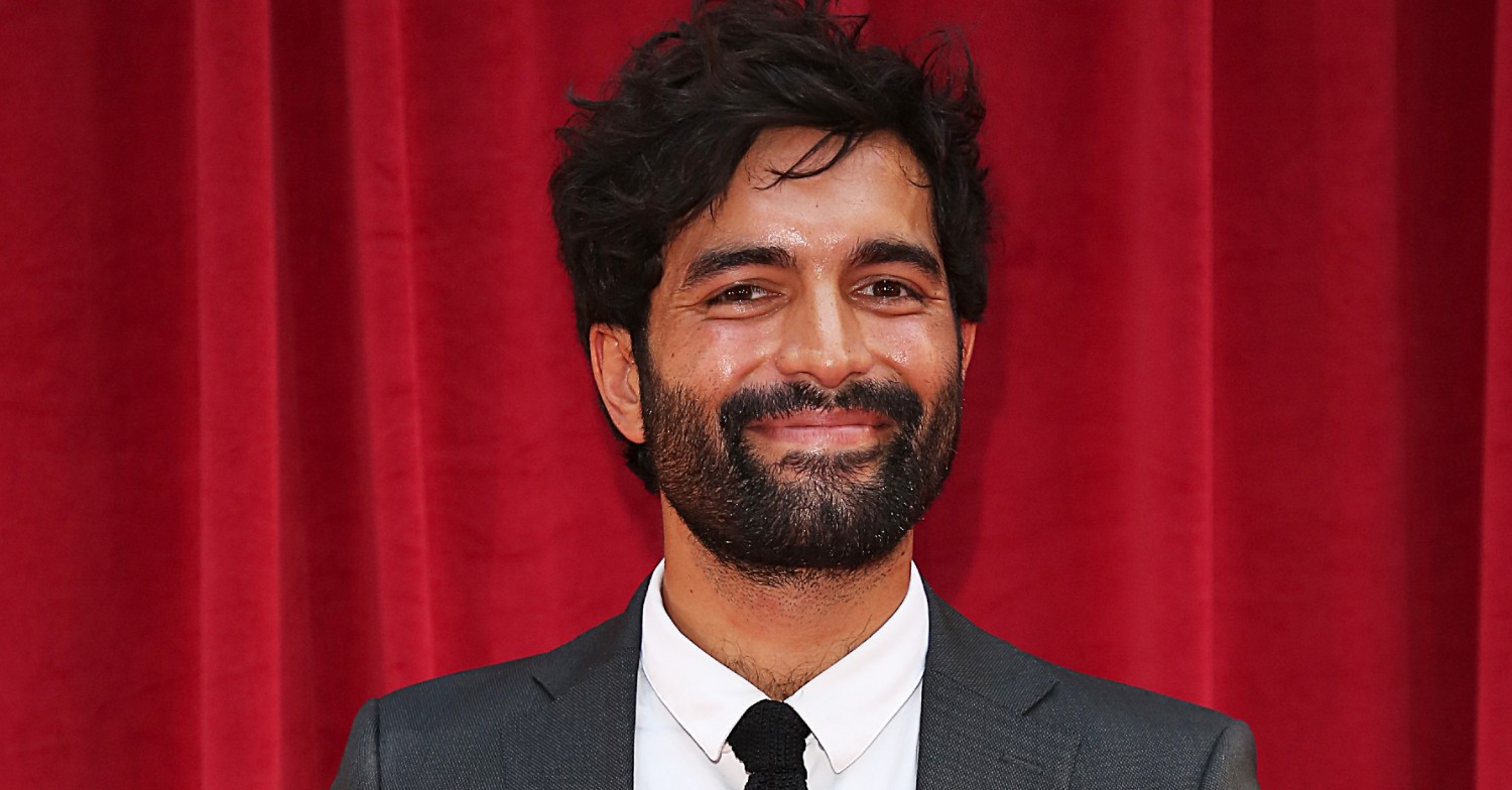Coronation Street star Charlie De Melo posing at an awards show