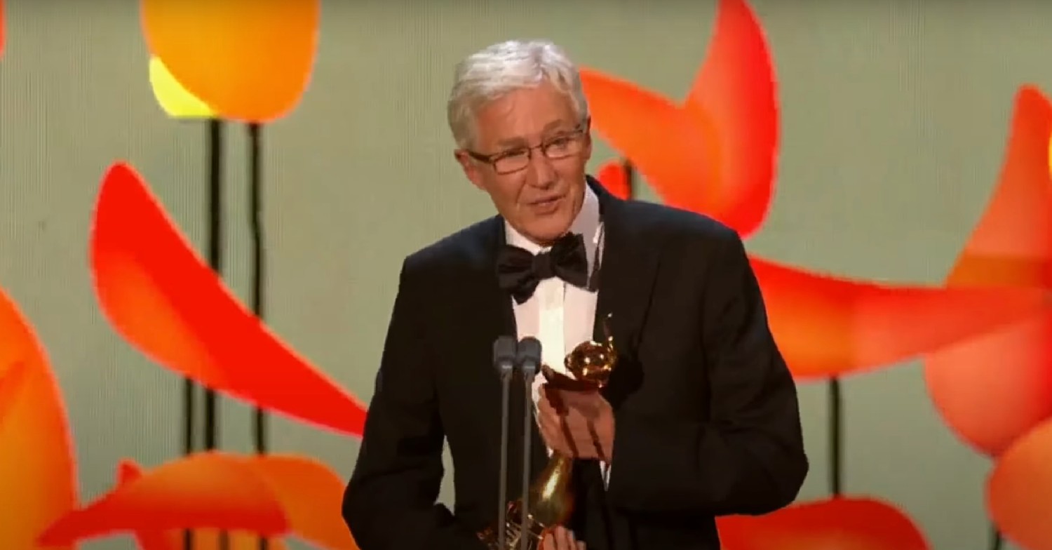 Paul O'Grady holding an NTA 