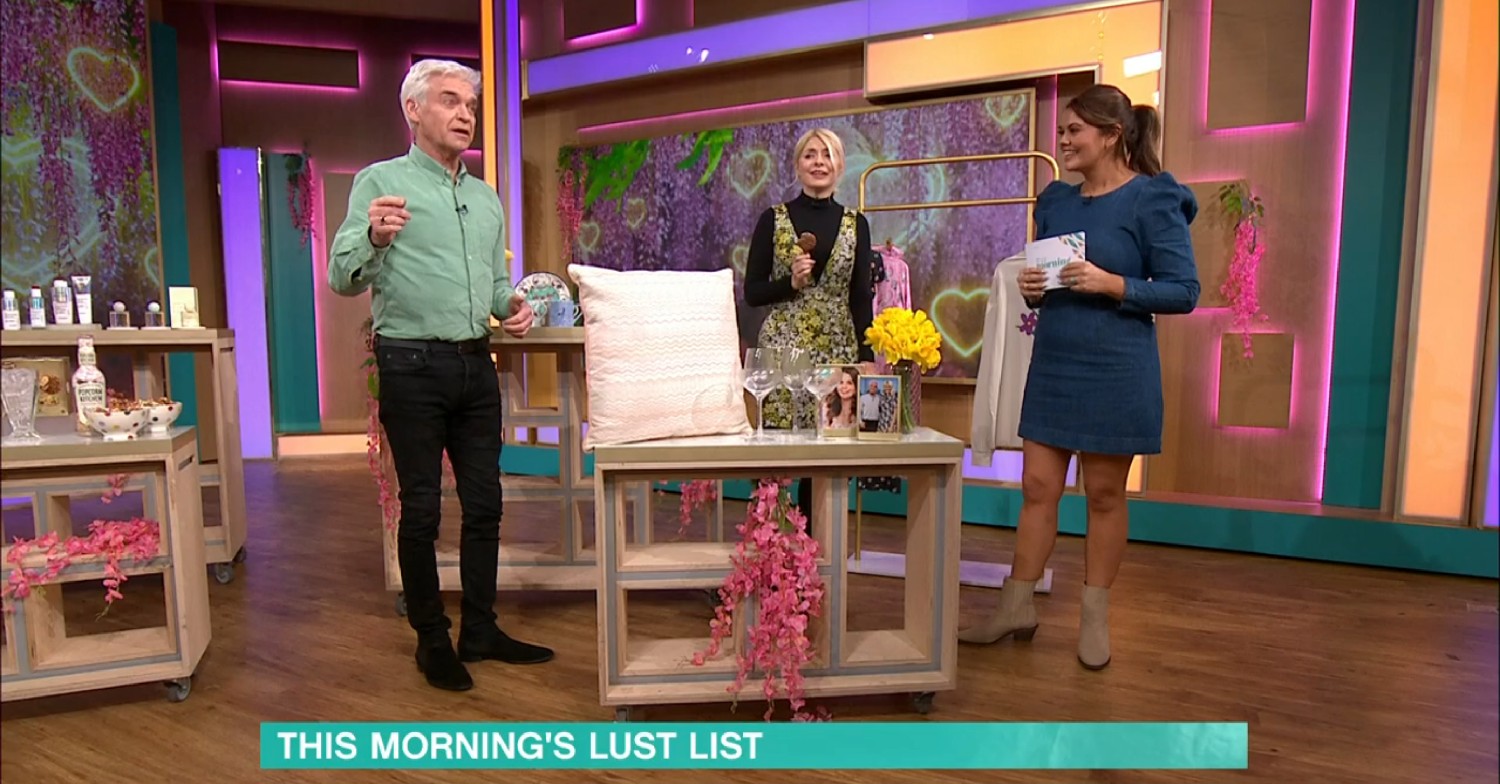 Phillip Schofield and Holly Willoughby standing around speaking to a guest on This Morning 
