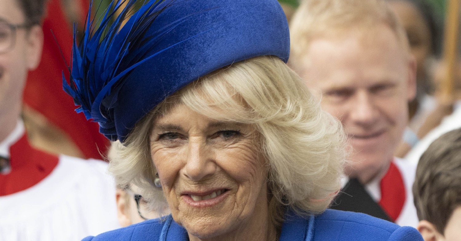 Queen Consort Camilla smiling in blue 