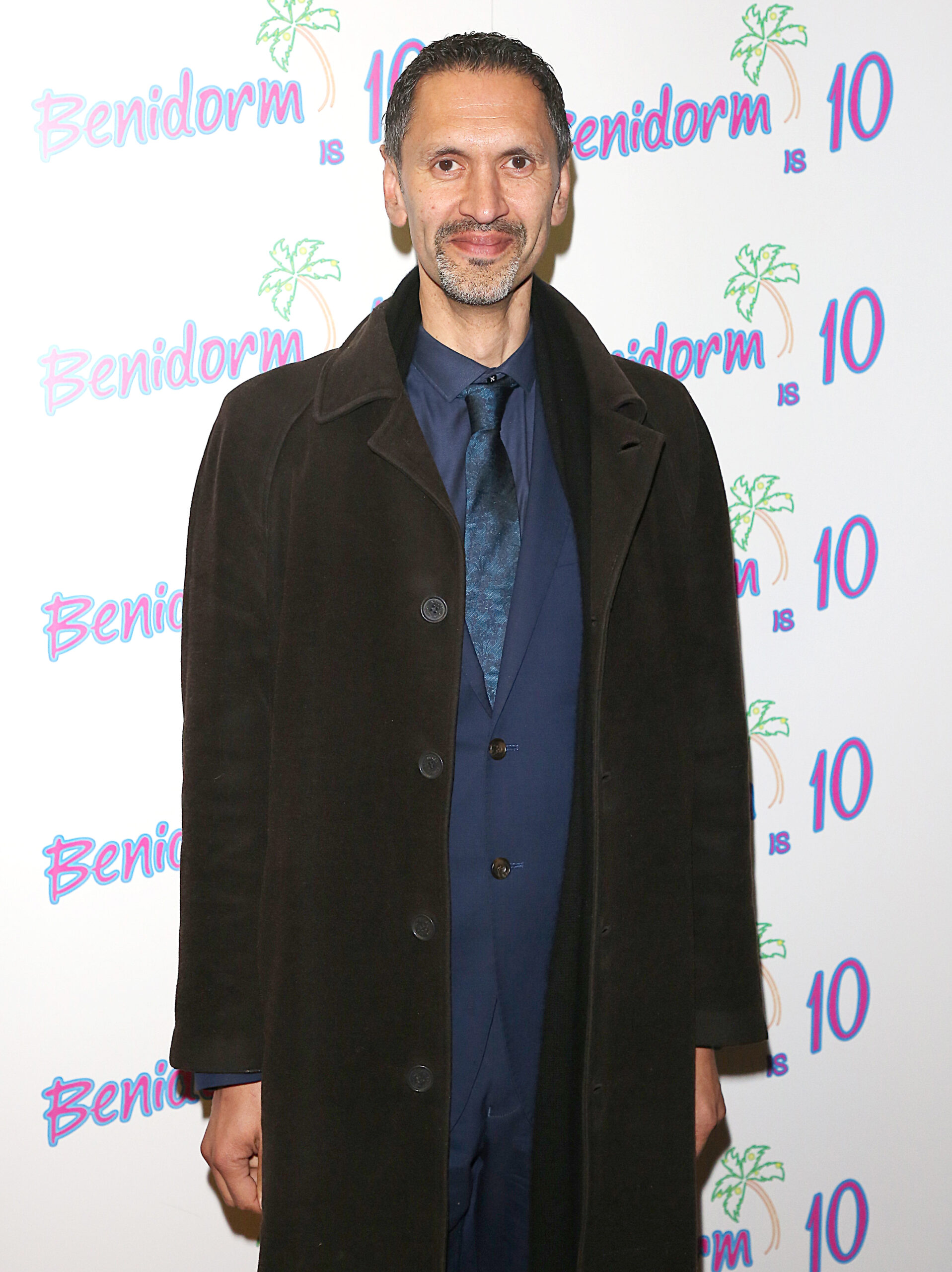 Paul Bazely smiles at camera at Benidorm party